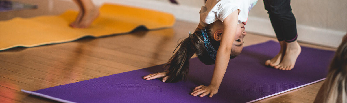 Kids doing Downward Facing Dog Yoga