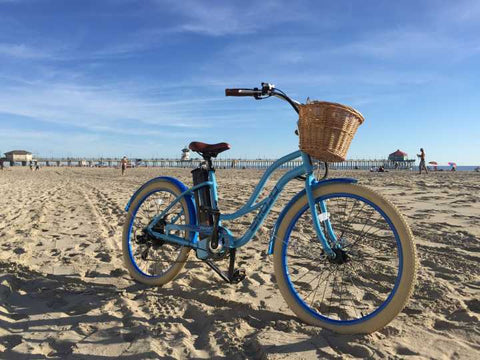 Blue EMOJO Breeze Electric Bike - On the sand