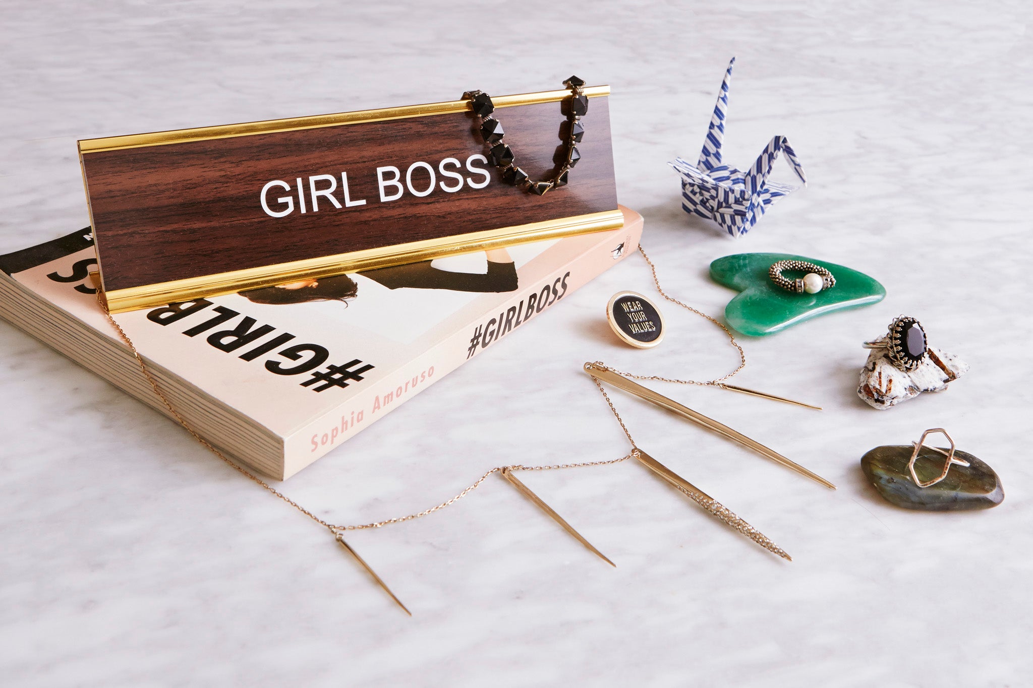 girl boss nameplate and assorted jewelry from britt bergmeister for shiffon co.