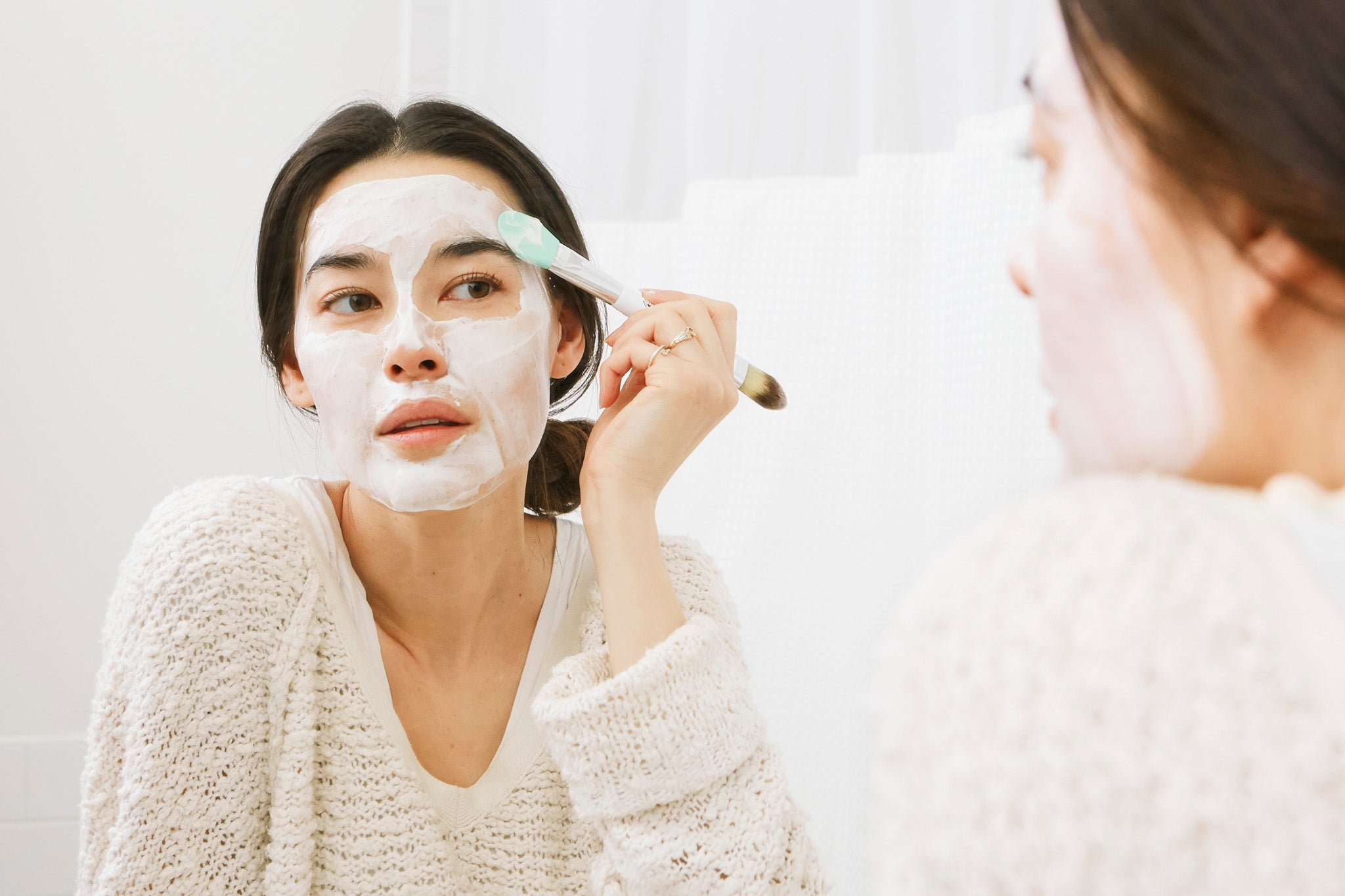 stephanie peterson applying a face mask