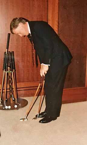 Vice President Dan Quayle trying out an Otey Crisman putter