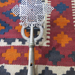 Ethiopian standing cross on an Afghan kelim