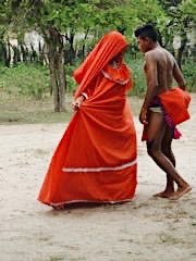 wayuu woman in red and man dancing
