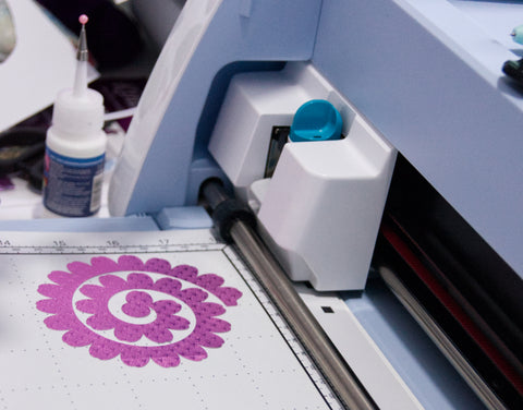 Rolled flower cutting file with the fuchsia starstruck foiled paper