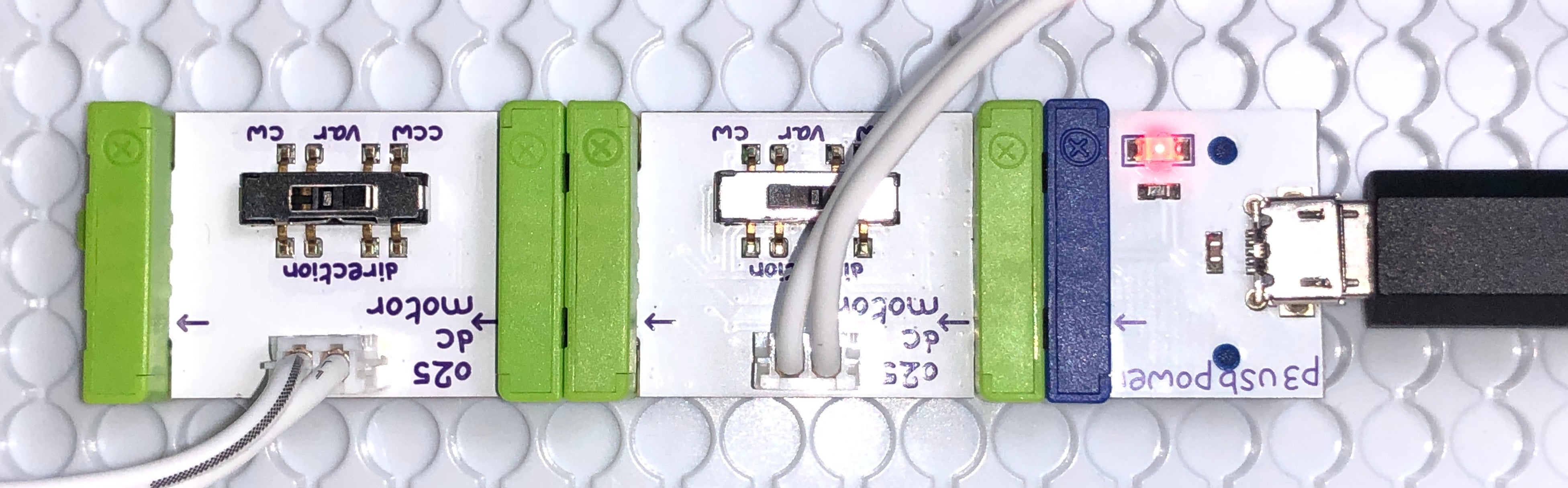2 DC motor littleBits connected to power