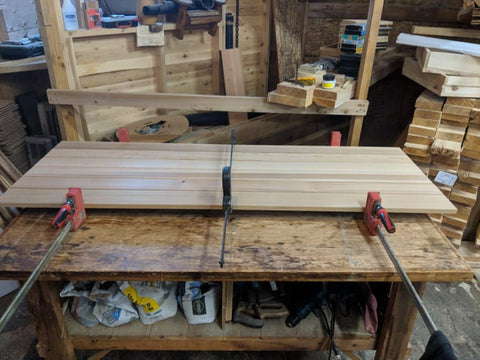 Panels for a cedar door. Gluing/clamping stage.