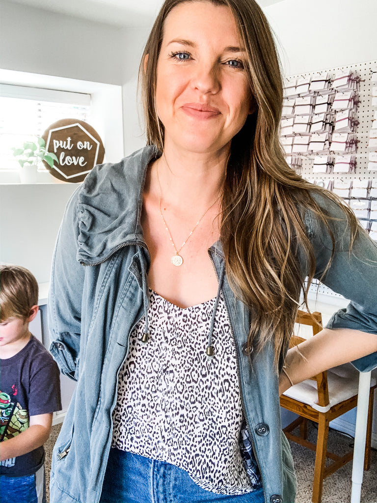 necklace on grey outfit