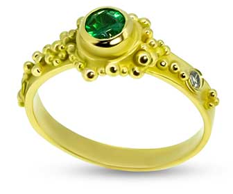 Emerald re-set into granulated ring