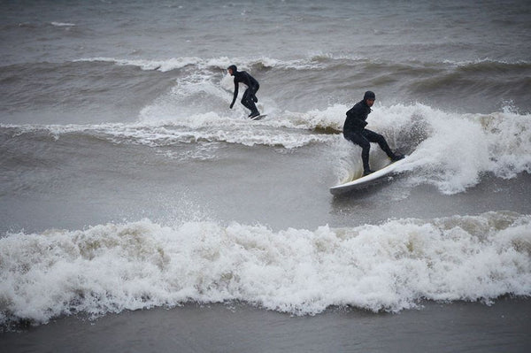 Geoff Ortiz on the SUP and Alex Boutilier trailing on Lake Ontario. Photo by Seed9.