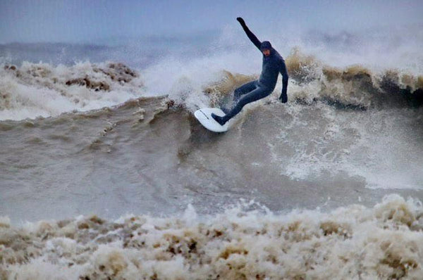 Geoff Johnson off the top of a Lake Ontario wave. Photo by Donald LeBlanc.
