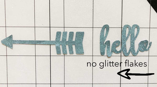 arrow and hello cut outs on a cutting mat