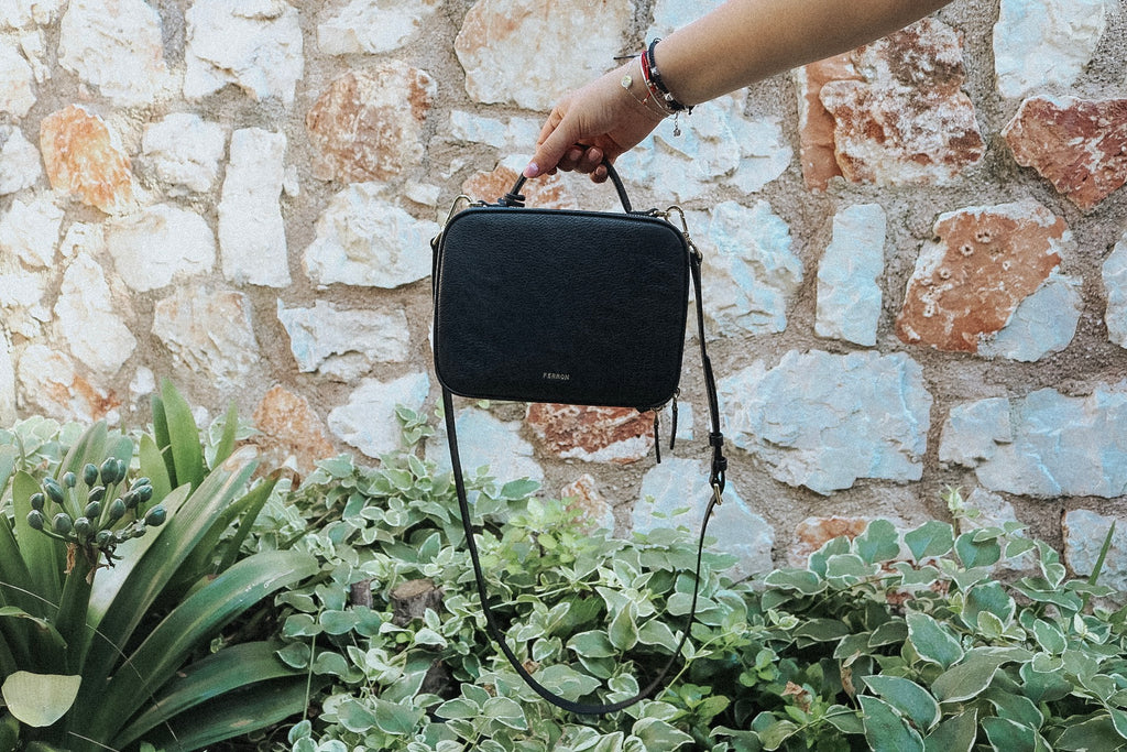 Close up on FERRON'S vegan leather handbag in black