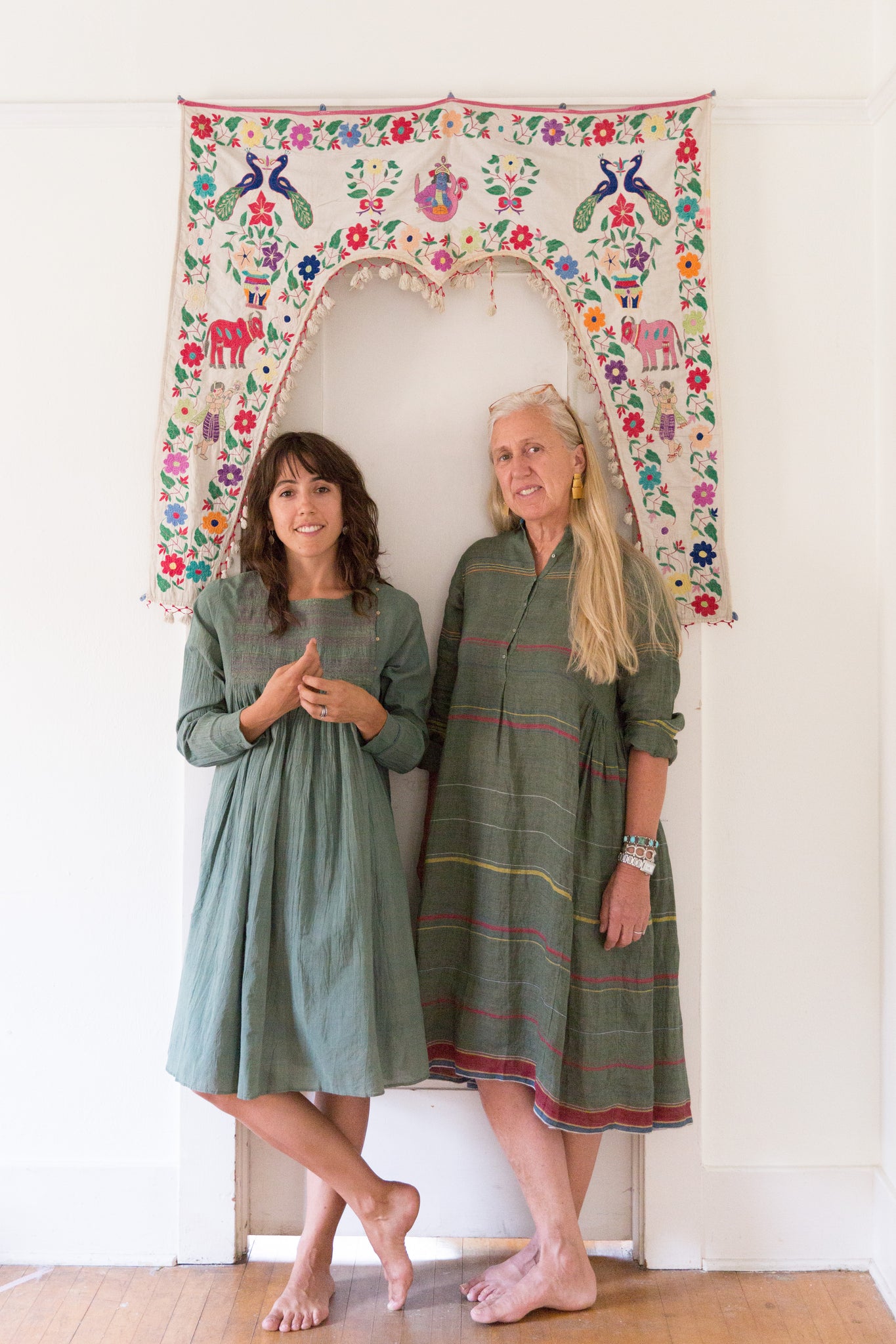 Dotter owners, Susanne McLean and Annika Huston, wearing Injiri in doorway