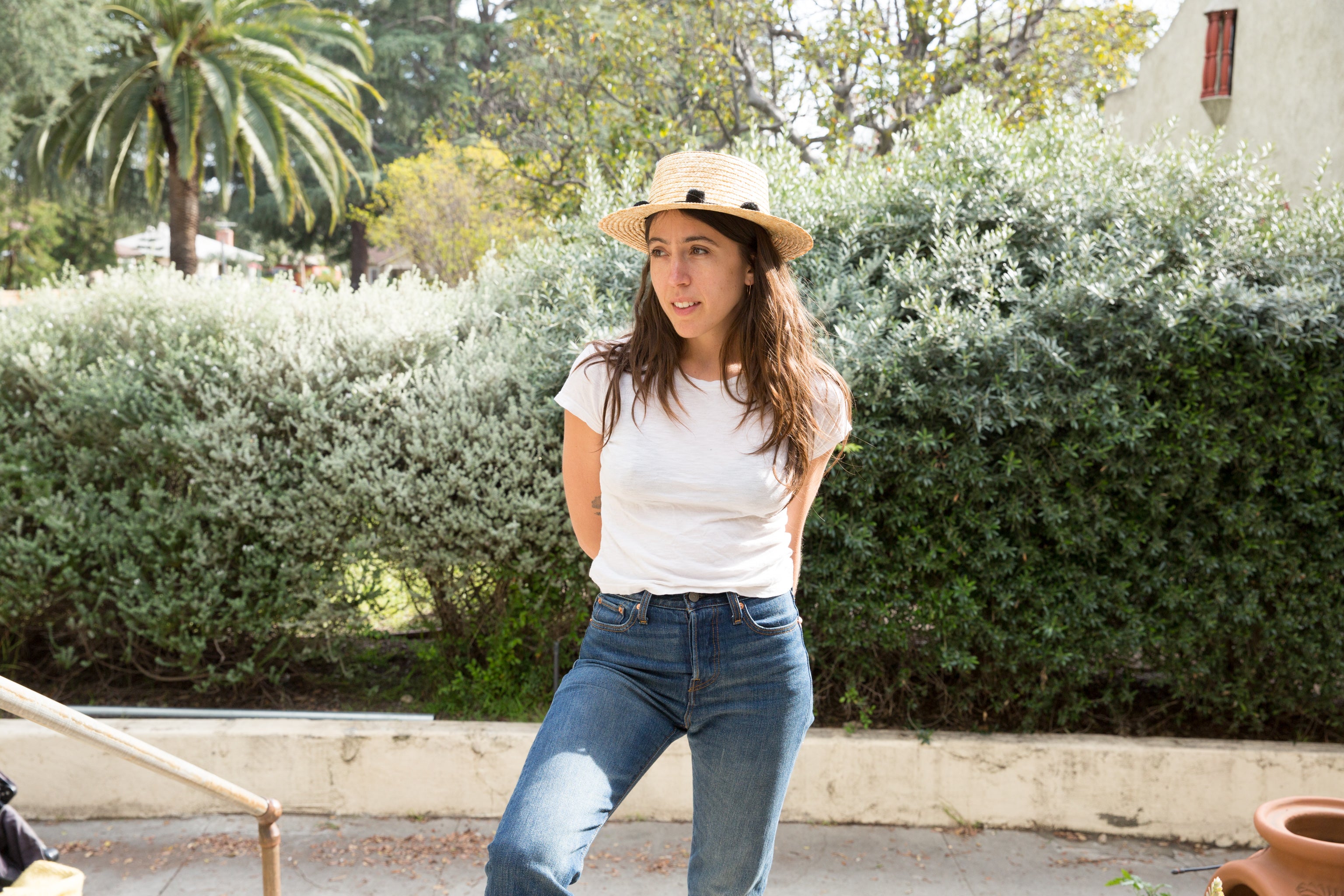 Dotter owner, Annika Huston, wearing It Is Well tee and woven hat