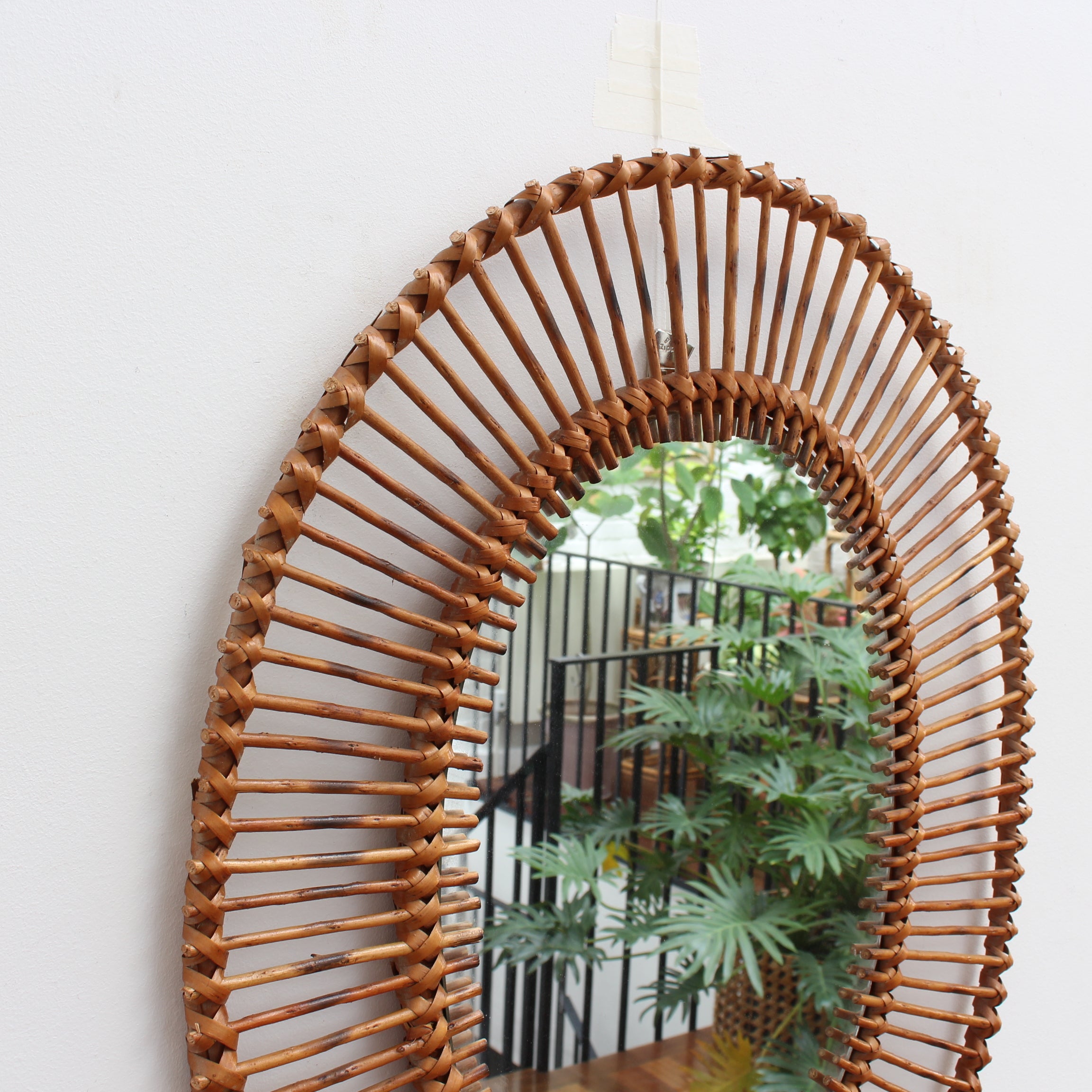 French Rattan Oval-Shaped Wall Mirror (circa 1960s)