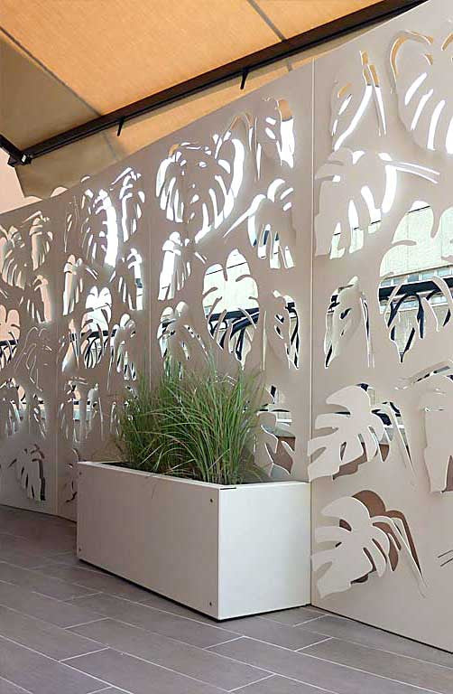 Monstera deliciosa laser cut panels with aluminum planters fixed to the balustrade.