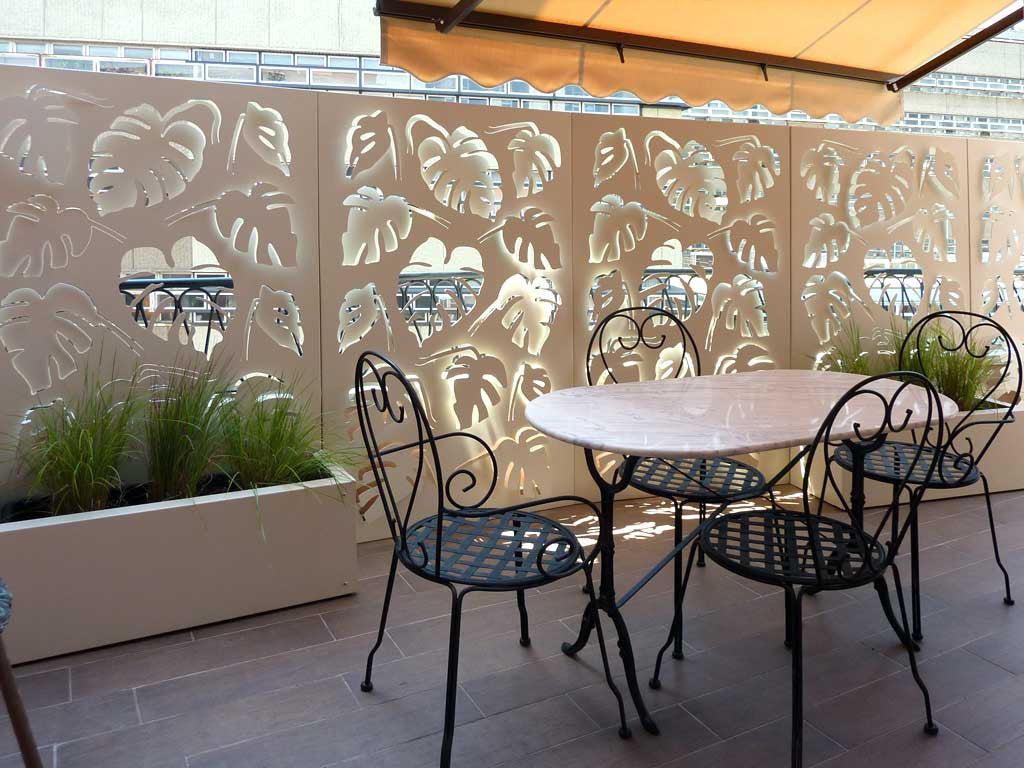 Monstera deliciosa laser cut panels with aluminum planters fixed to the balustrade.