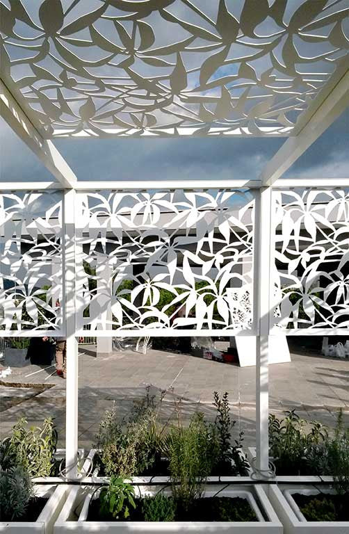 self standing shade structure for outdoor terrace with integrated planters; laser cut aluminum screens