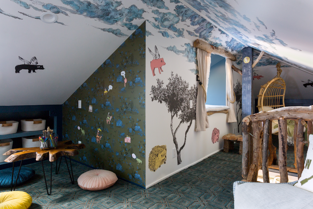 Attic play space with cloud ceiling, tree and animal wall stickers
