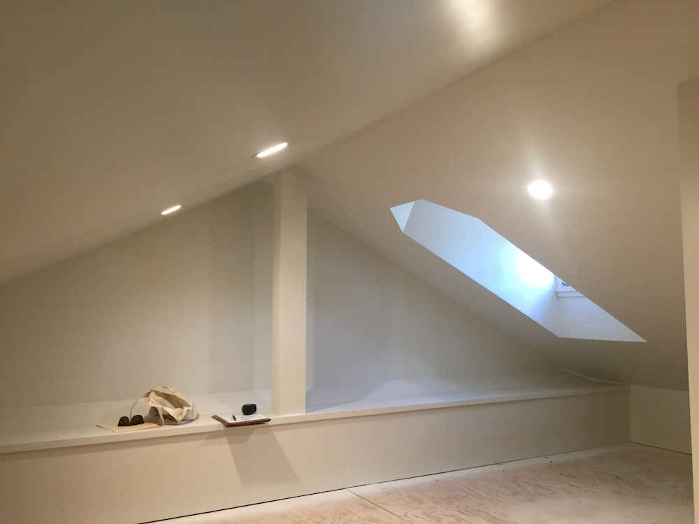 Unfinished white attic space
