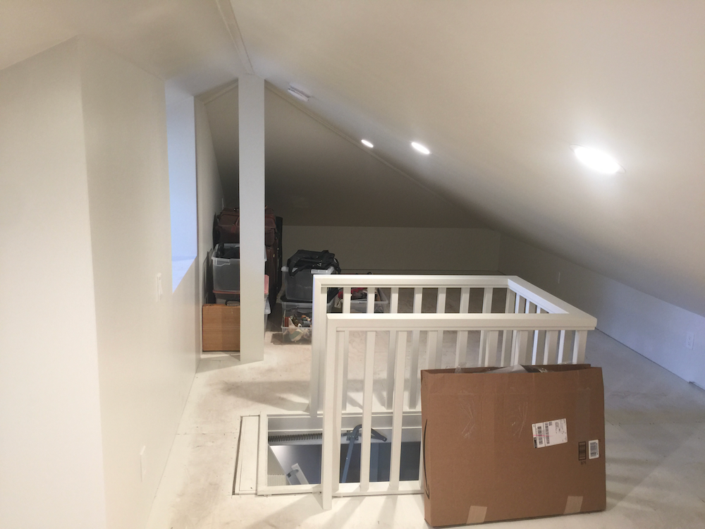 Unfinished white attic space
