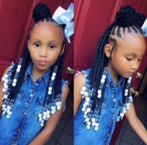 back to school hairstyles: young black girl with braids, bow and beads