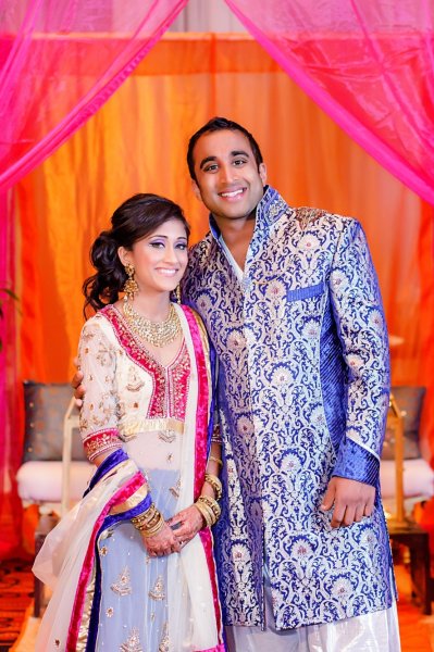 Brides Custom Made Sangeet Lehenga with long jacket and Grooms Indo-Western Matching Sherwani.