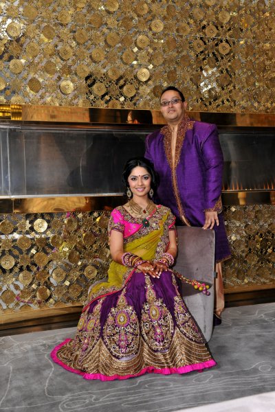 Brides Custom Made Sangeet Lehenga Choli and Grooms Indo-Western Matching Sherwani.