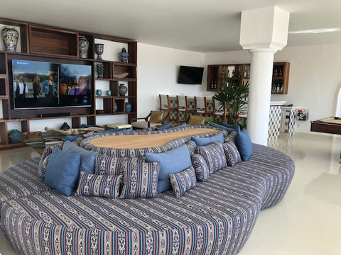 flat screen TV and lounge area at Mar del Cabo