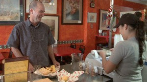 Luis Carrión learning about tamales at the Tucson Tamale Restaurant