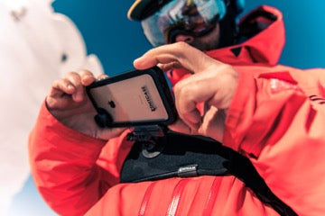 Man using iPhone as GoPro while skiing