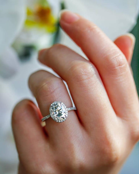 Oval Moissanite and Diamond Halo Engagement Ring in 14K White Gold