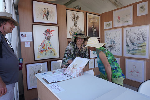 customers in Annie Moran art booth at New Orleans Jazz and Heritage Festival