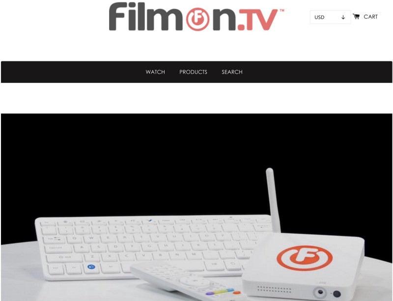 Filmon tv header showing a white keyboard, a white remote control and a white modem