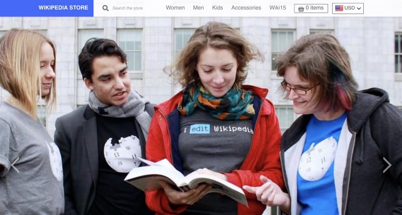 Wikipedia store site header with four people reading encyclopedia wearing wikipedia shirts