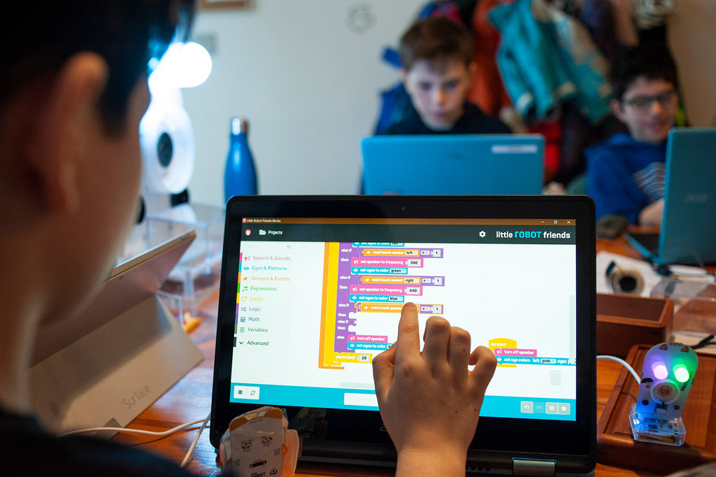 Kid learning to code at Little Robot Friends camp