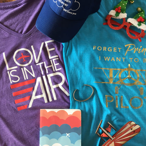 Love is in the air tee, forget princess I want to be a pilot tee, notebook, bracelet cuff, daydream believer hat