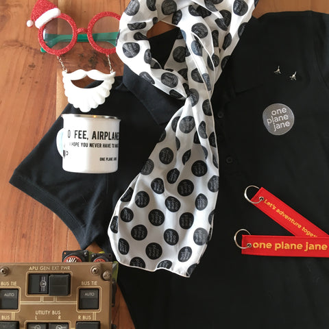 Black polo, airplane earrings, keychains, coffee mug, scarf