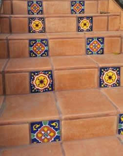 Decorative Talavera tiles on the risers pair well with Saltillo tiles