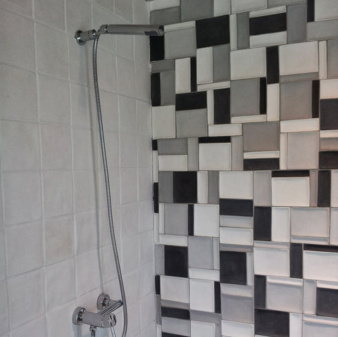 Relief Tiles like Avente's Elevations Cement Wall Tile Provide Texture for a Shower Wall