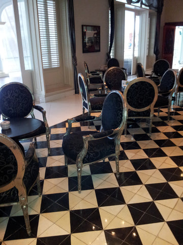 Black and White Cement Tiles in a Checkerboard Pattern Provide a Formal Look Similar to Polished Stone