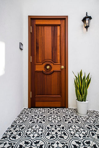 Mission Roseton Cement Floor Tile in Black and White Provides a Charming Welcome for This Entry
