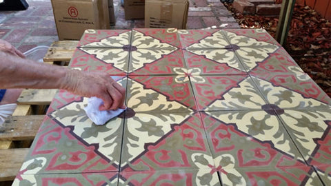 Pre-sealer being applied to cement tile