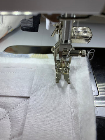 Fold binding back and start stitching