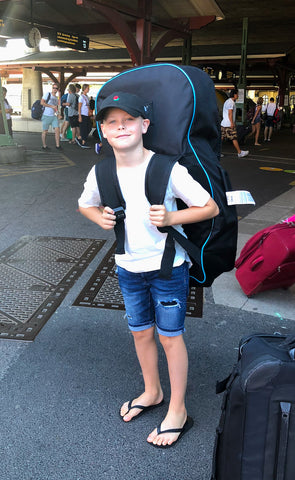 Kid wearing inflatable stand up paddle board 