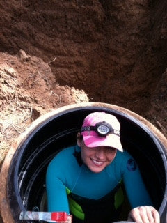 Christa going down the cistern hole.