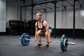 Woman deadlifts