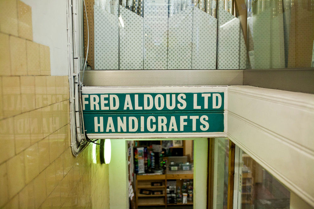 Fred Aldous sign on stairs