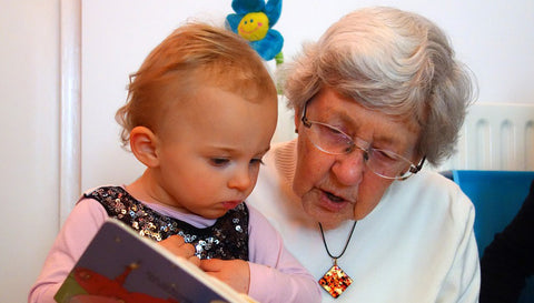 grandparents-reading-to-their-grandchildren