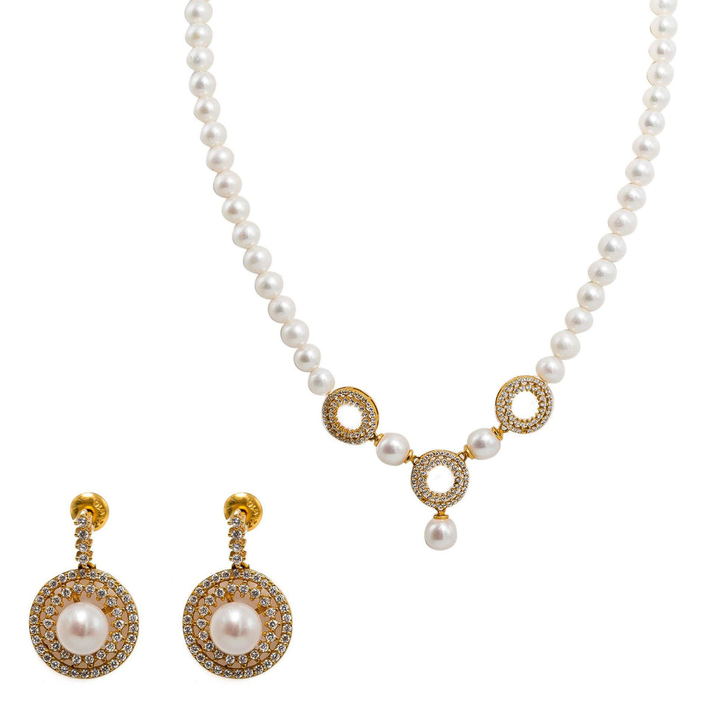 gold pearl necklace and earrings